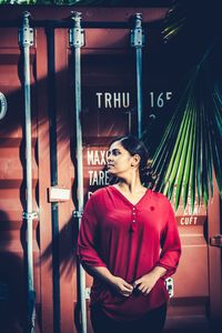 Portrait of woman standing at temple