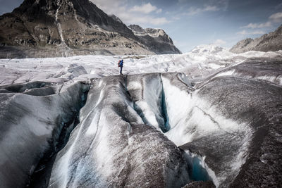 Man standing on snow covered mountain