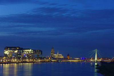 Illuminated buildings at waterfront