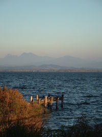 Scenic view of sea against clear sky during sunset