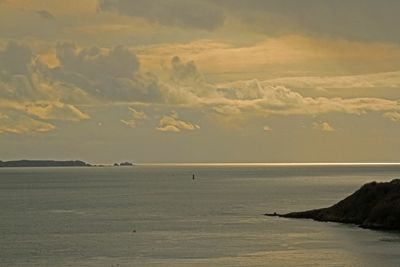 Scenic view of sea at sunset