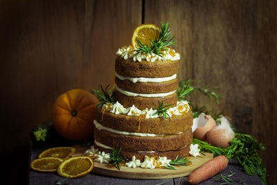 Close-up of vegetables and cake on table