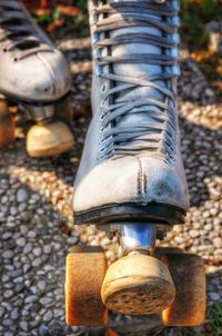 Close-up of roller skate on footpath