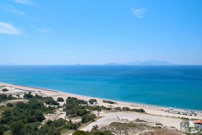 Scenic view of sea against blue sky