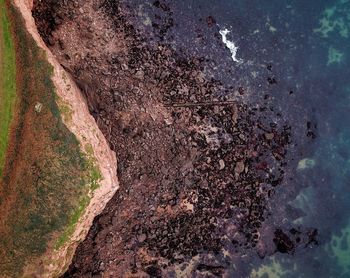 High angle view of water drops on rocks