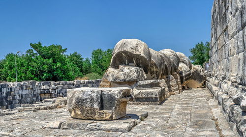 View of old ruins against blue sky