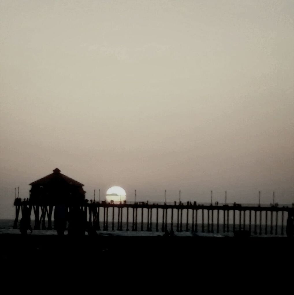 copy space, clear sky, silhouette, sky, sea, built structure, railing, architecture, sunset, water, dusk, nature, horizon over water, tranquility, tranquil scene, outdoors, scenics, incidental people, no people, beauty in nature