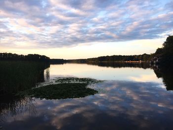 Scenic view of lake against sky during sunset