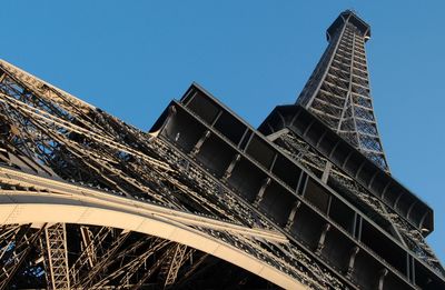 Low angle view of modern building against blue sky