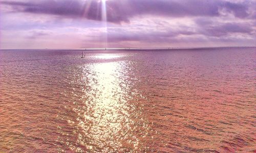 Scenic view of sea against sky at sunset