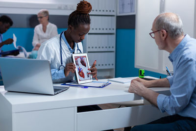 Doctor consulting with patient in clinic