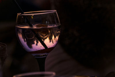 Close-up of wine in glass during sunset