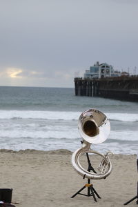 French horn at beach