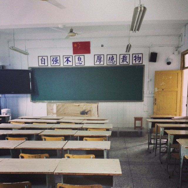 indoors, empty, text, absence, communication, western script, chair, seat, in a row, no people, education, table, interior, day, book, wall - building feature, arrangement, office, flooring, wall