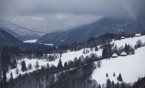 Scenic view of mountains against sky during winter