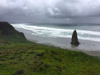 Scenic view of sea against cloudy sky