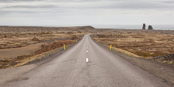 Road amidst landscape against sky