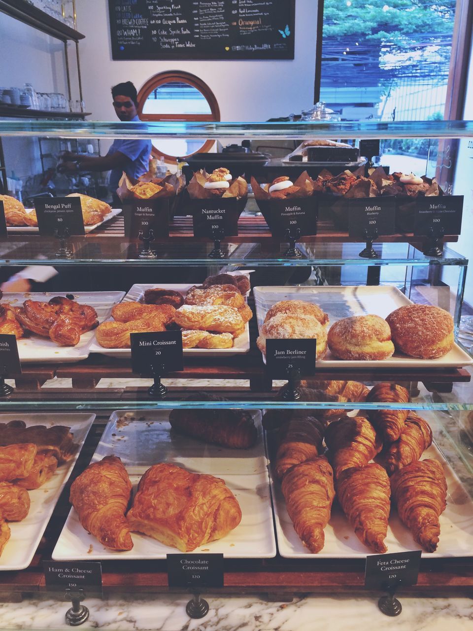 food and drink, food, indoors, indulgence, variation, retail, store, baked, freshness, bakery, sweet food, dessert, display cabinet, unhealthy eating, choice, for sale, cake, croissant, ready-to-eat, temptation, baked pastry item, no people, meat, french food, close-up, day