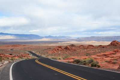 Country road with mountains in background