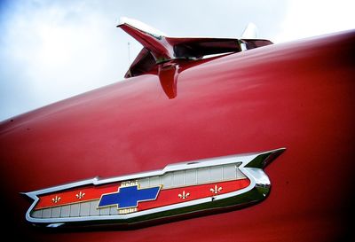 Close-up of vintage car on airplane against sky