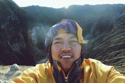 Portrait of man against mountain