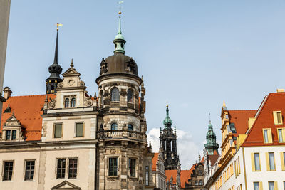 Low angle view of buildings in city against sky