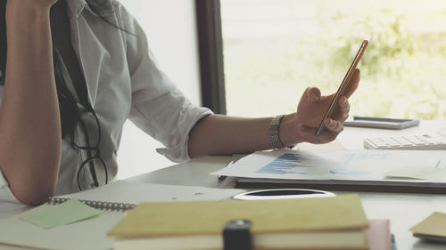 Low angle view of person working on table