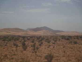 Scenic view of desert against sky