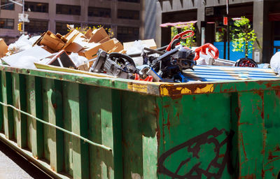 Garbage bin on metal structure