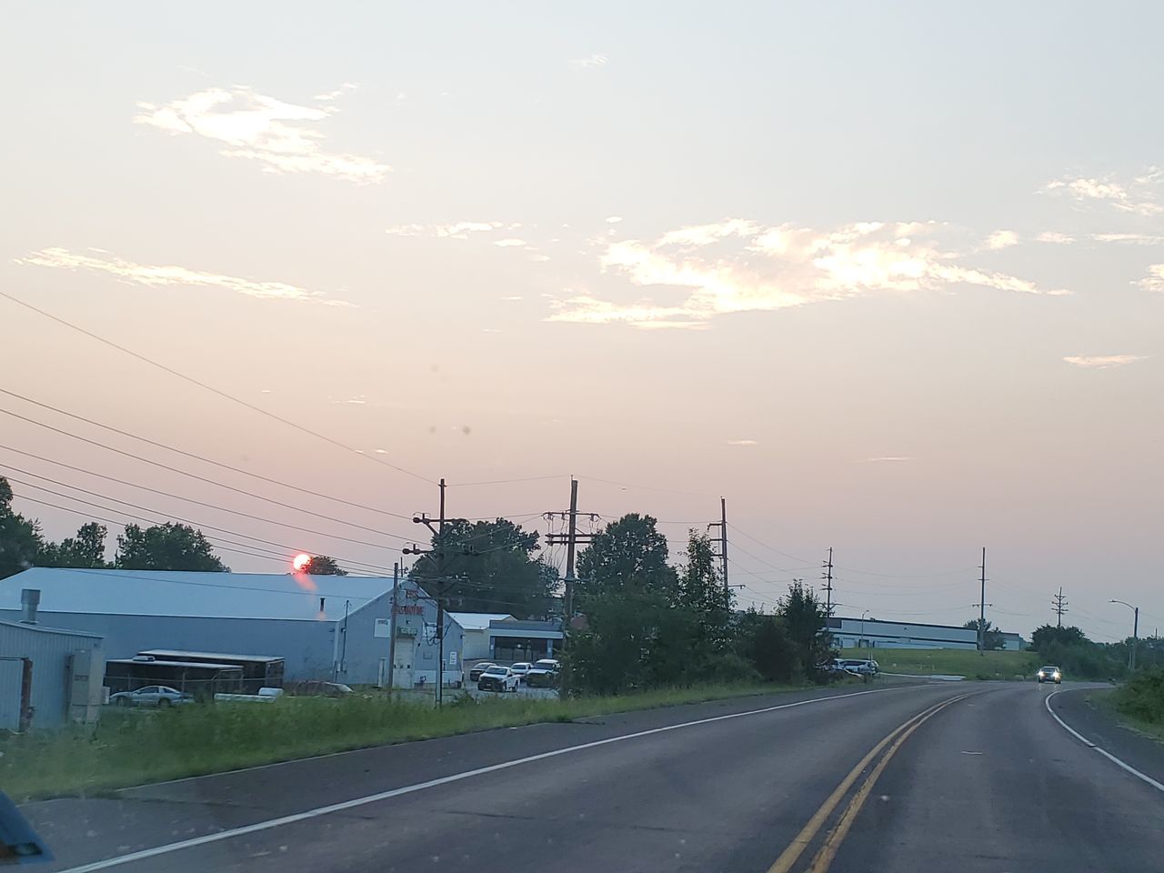 ROAD AGAINST SKY AT SUNSET