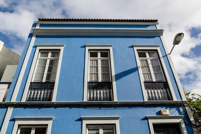 Low angle view of residential building against sky