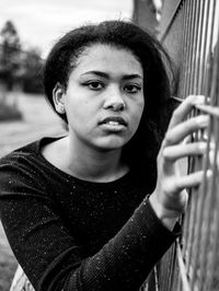 Portrait of beautiful young woman standing outdoors