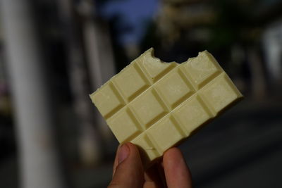 Close-up of hand holding ice cream cone