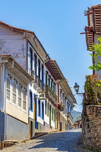 Cobblestone street with old and colorful colonial houses in the historic city of ouro preto