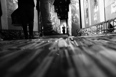 Low section of people walking on street