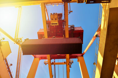 Low angle view of crane against clear sky