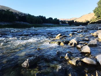 Scenic view of river against clear sky