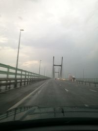 View of road against cloudy sky