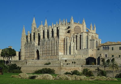 Exterior of temple against clear blue sky
