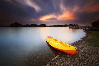Scenic view of river against sky during sunset