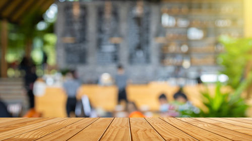 Close-up of people on table at restaurant