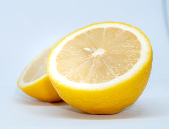 Close-up of orange slice against white background