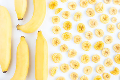 High angle view of chopped slices over white background