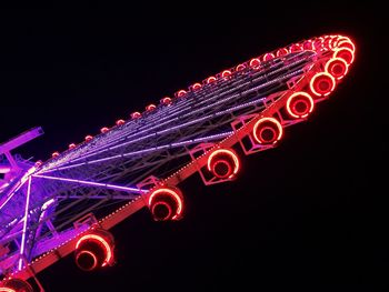 Low angle view of illuminated lights at night