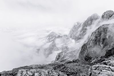 Scenic view of waterfall against sky