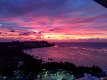 Scenic view of sea against orange sky