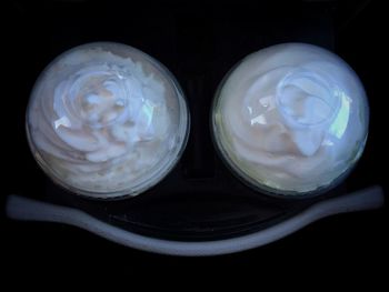 Close-up of glass over black background