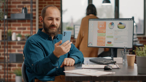 Smiling businessman talking on video call