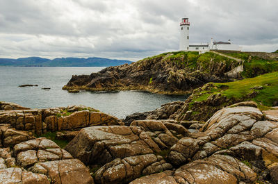 Scenic view of sea against cloudy sky