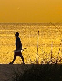 Scenic view of sea at sunset